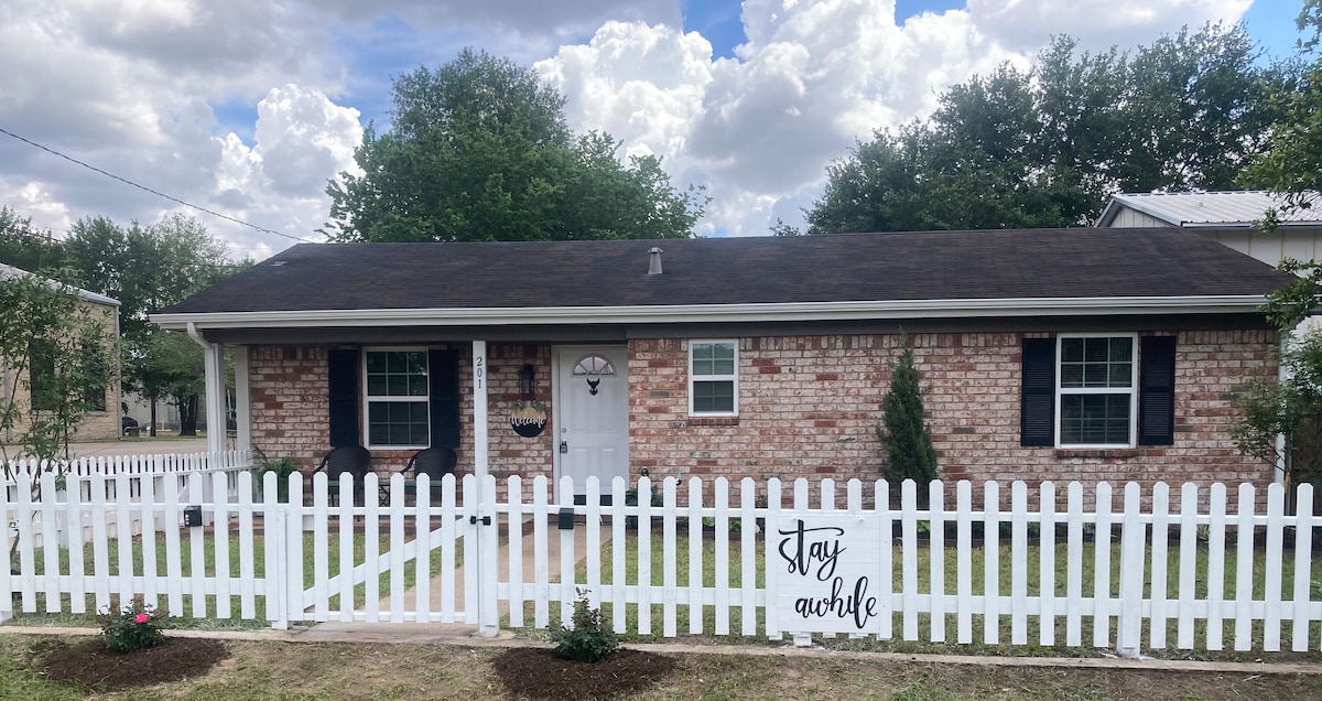 White picket fence at the front of the home